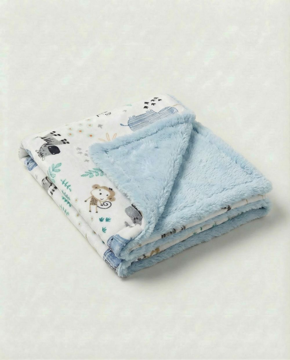 Soft baby blanket with adorable elephant and animal friends print and plush backing, perfect for newborn snuggles.