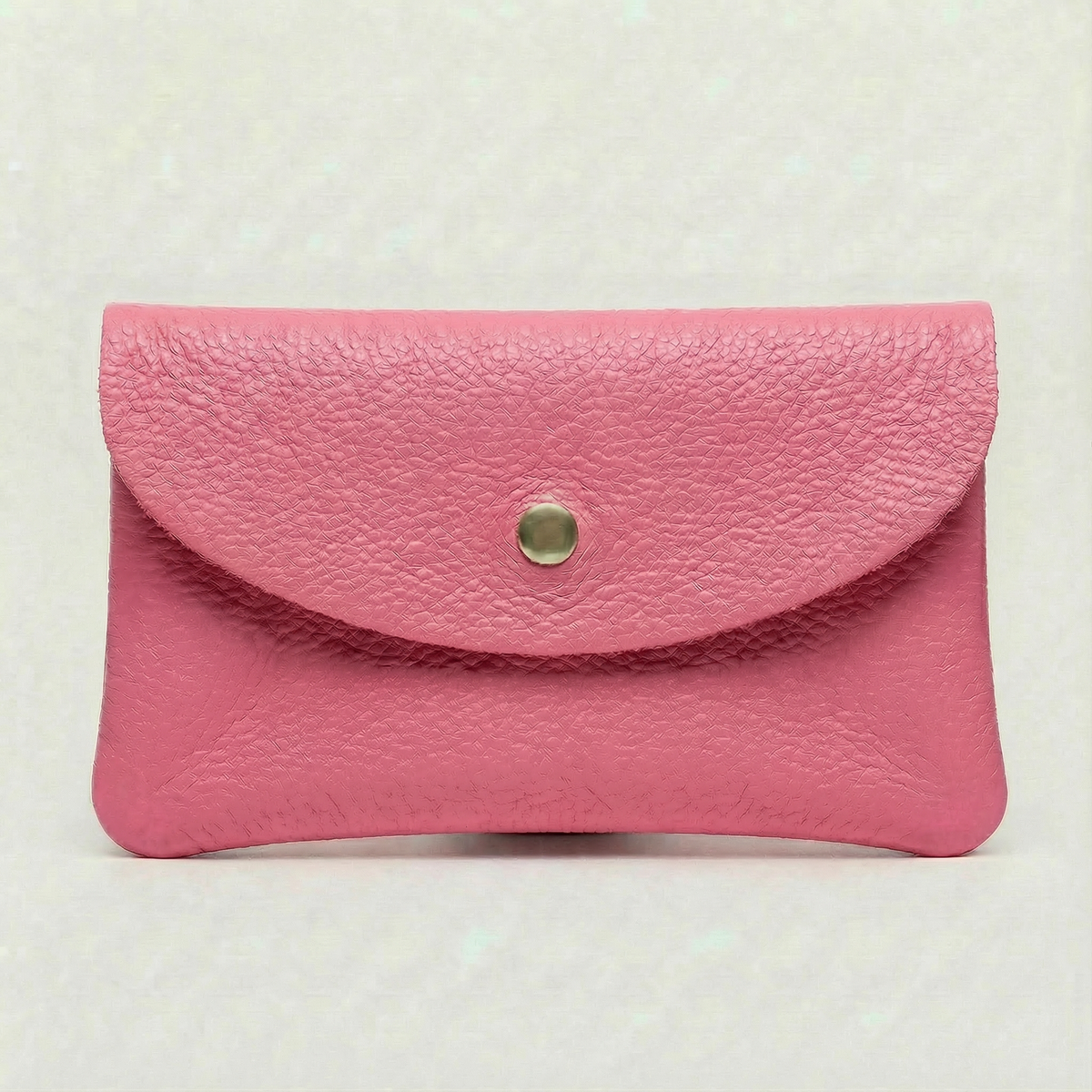 Barbie Pink pebble leather wallet collection featuring Mini Coin Wallet, Coin Wallet, and Cellphone Wallet in genuine leather, made in Italy.
