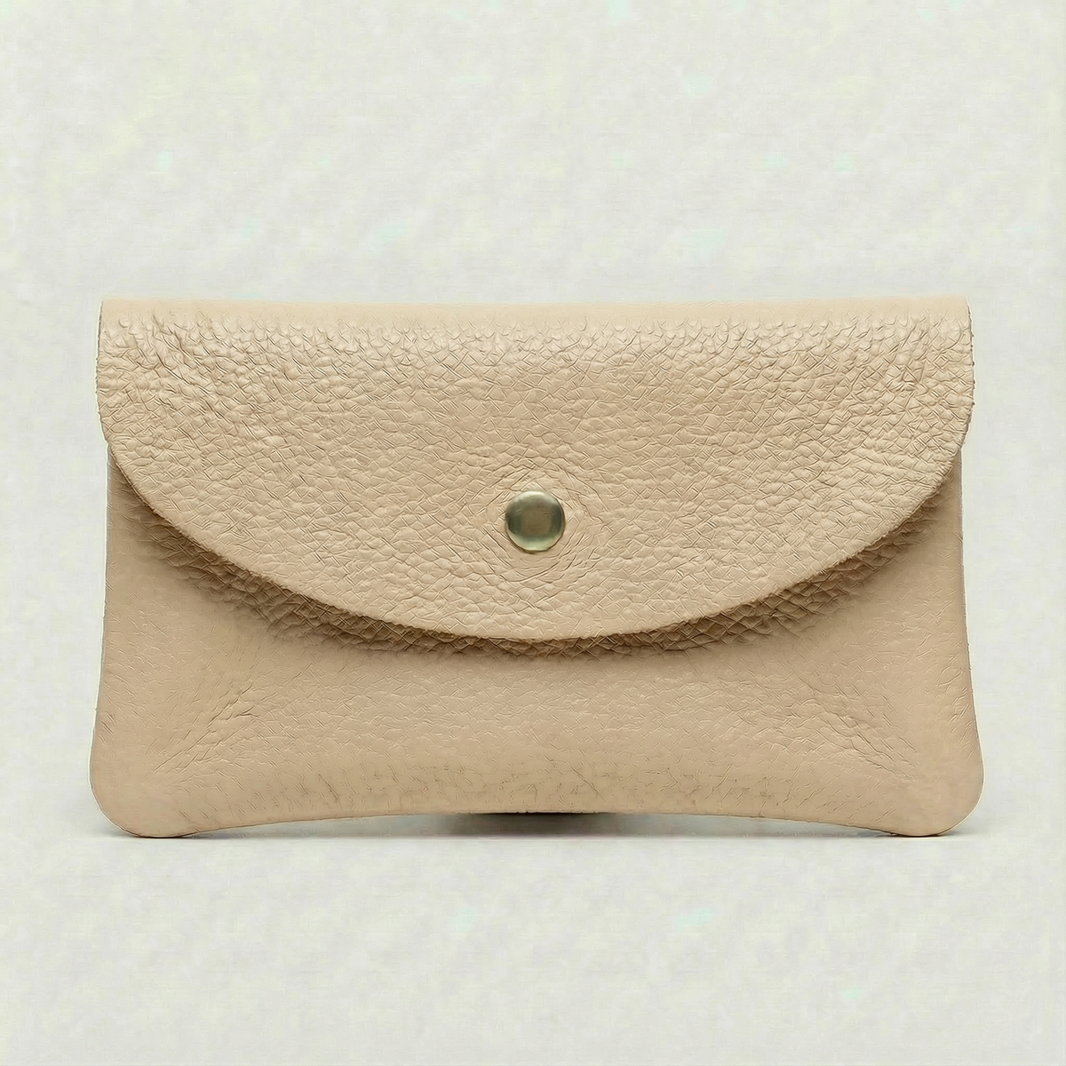 Beige pebble leather wallet collection featuring Mini Coin Wallet, Coin Wallet, and Cellphone Wallet in genuine leather, made in Italy.