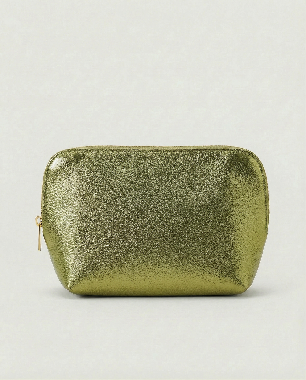 Metallic pistachio leather cosmetic bag with structured shape and top zip closure, shown in a sleek, minimalist style.