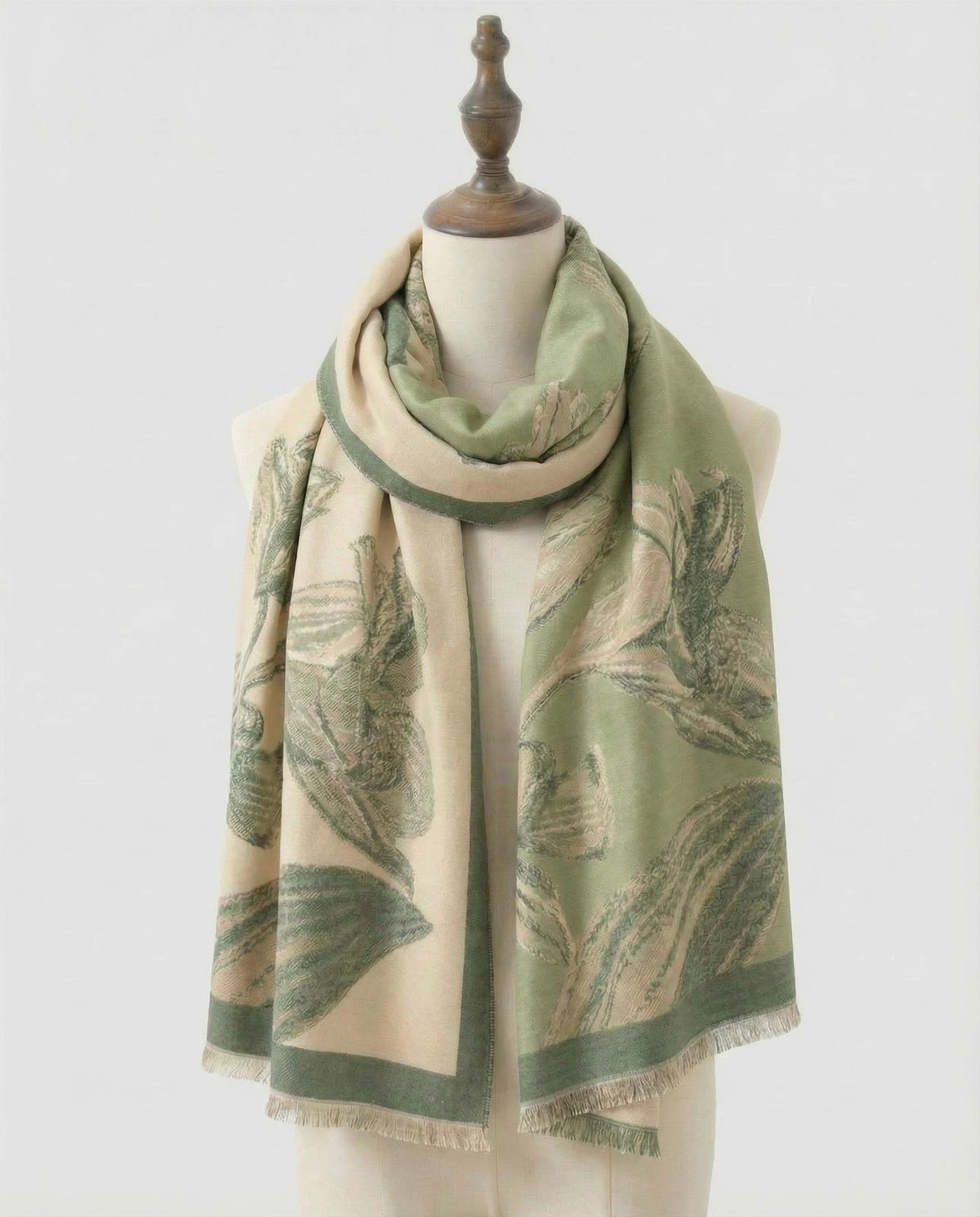 Sage green and beige wrap with dandelion pattern on a white background