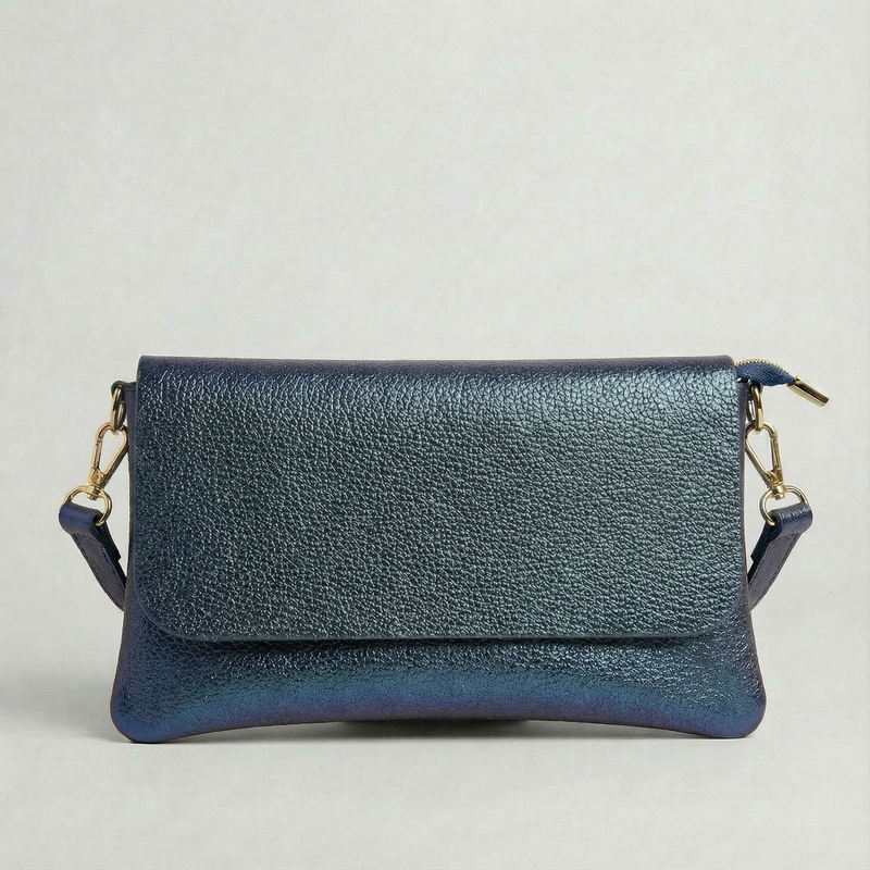 Denim metallic leather crossbody bag with a matching color leather strap, displayed on a light gray background.