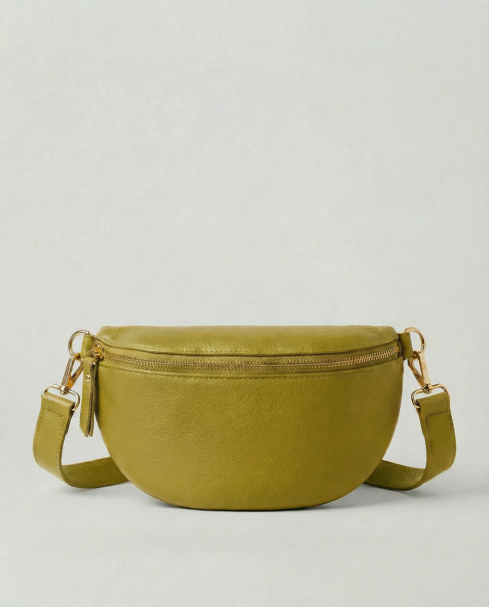 Chartreuse pebble leather fanny bag with adjustable strap and compact, hands‑free design.