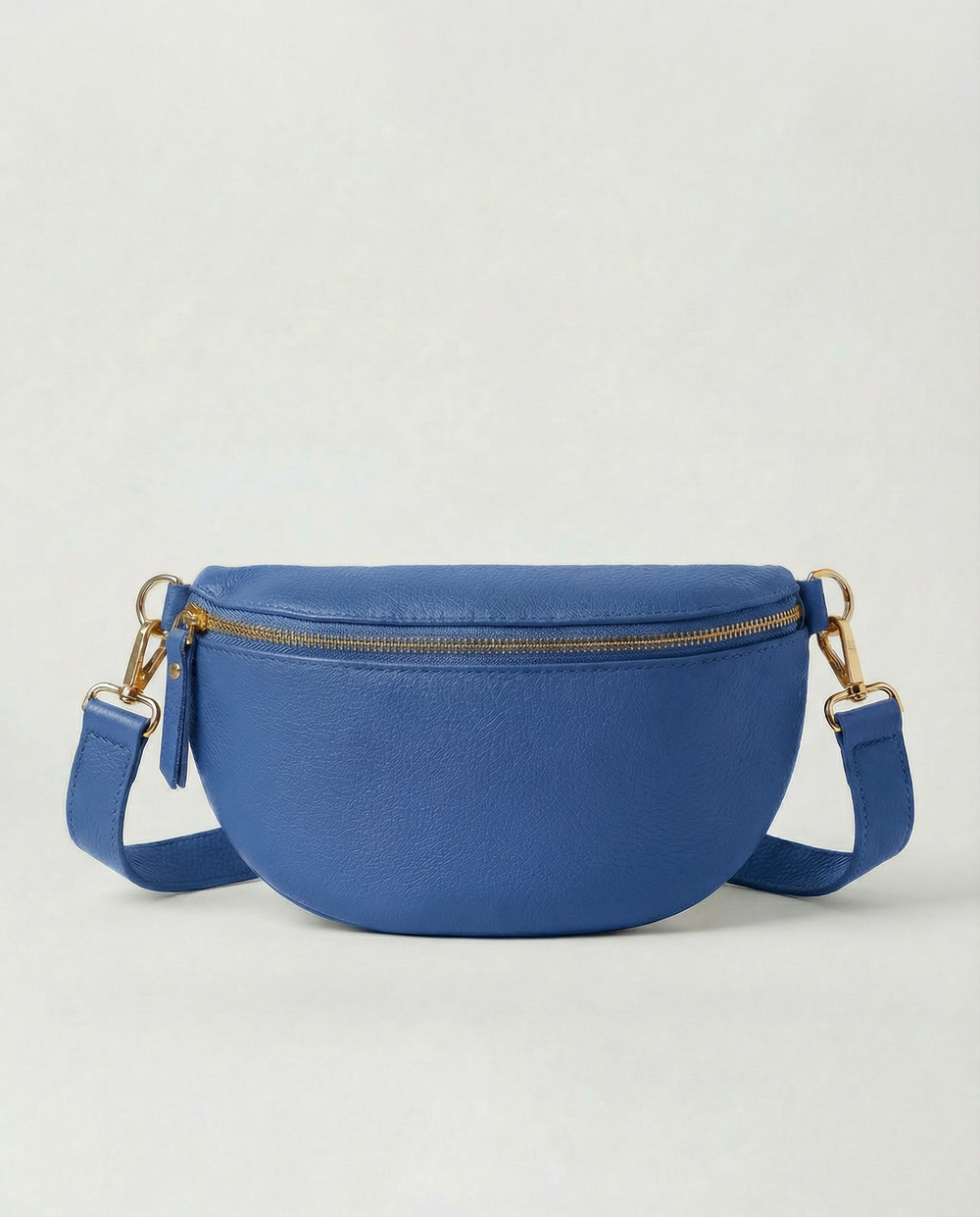 Royal blue pebble leather fanny bag with adjustable strap and compact, hands‑free design.