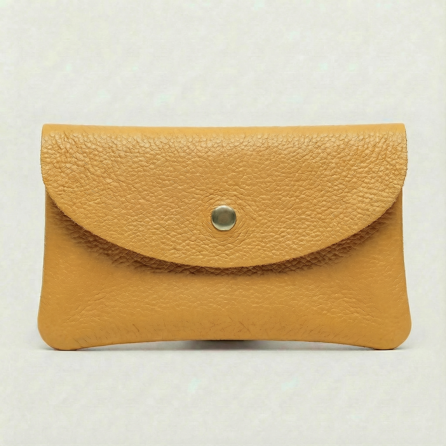 Flamingo color leather cellphone wallet with a gold button on a white background.