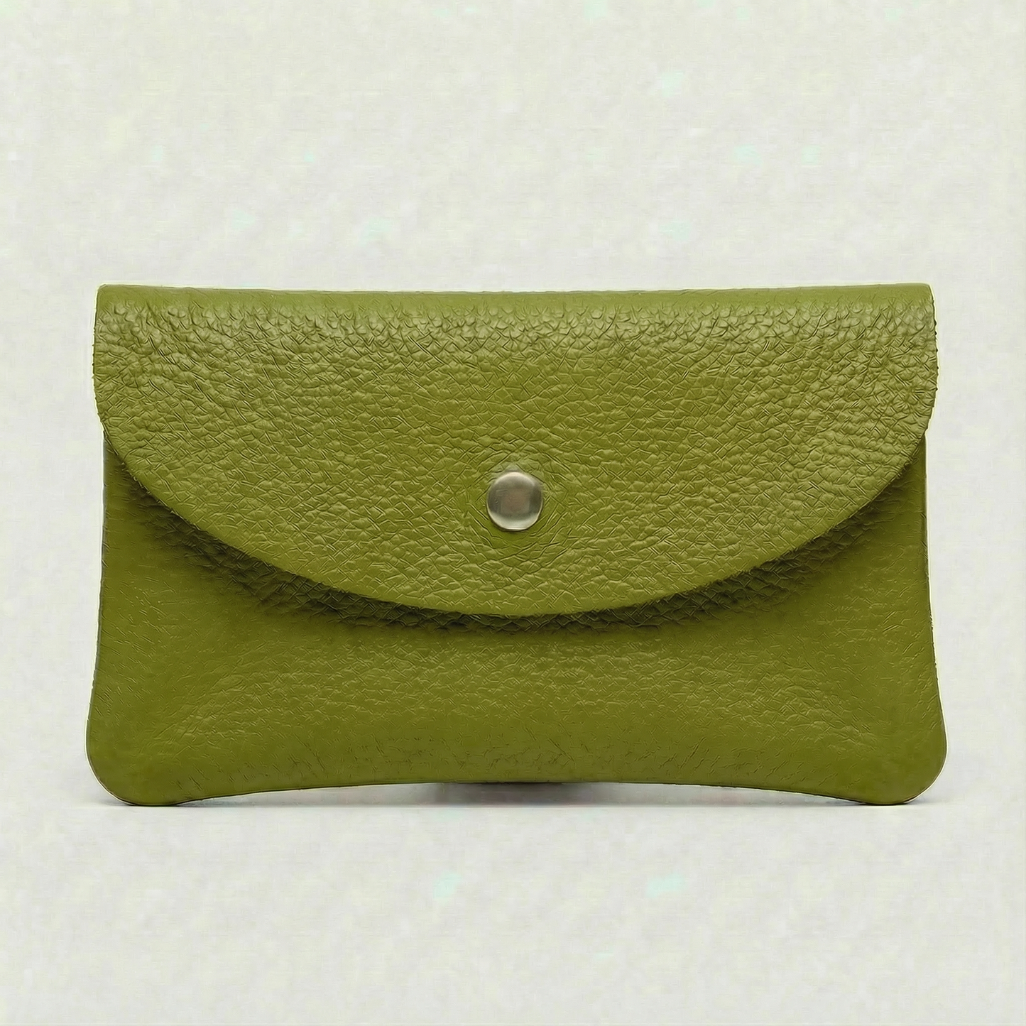 Green pebble leather wallet collection featuring Mini Coin Wallet, Coin Wallet, and Cellphone Wallet in genuine leather, made in Italy.