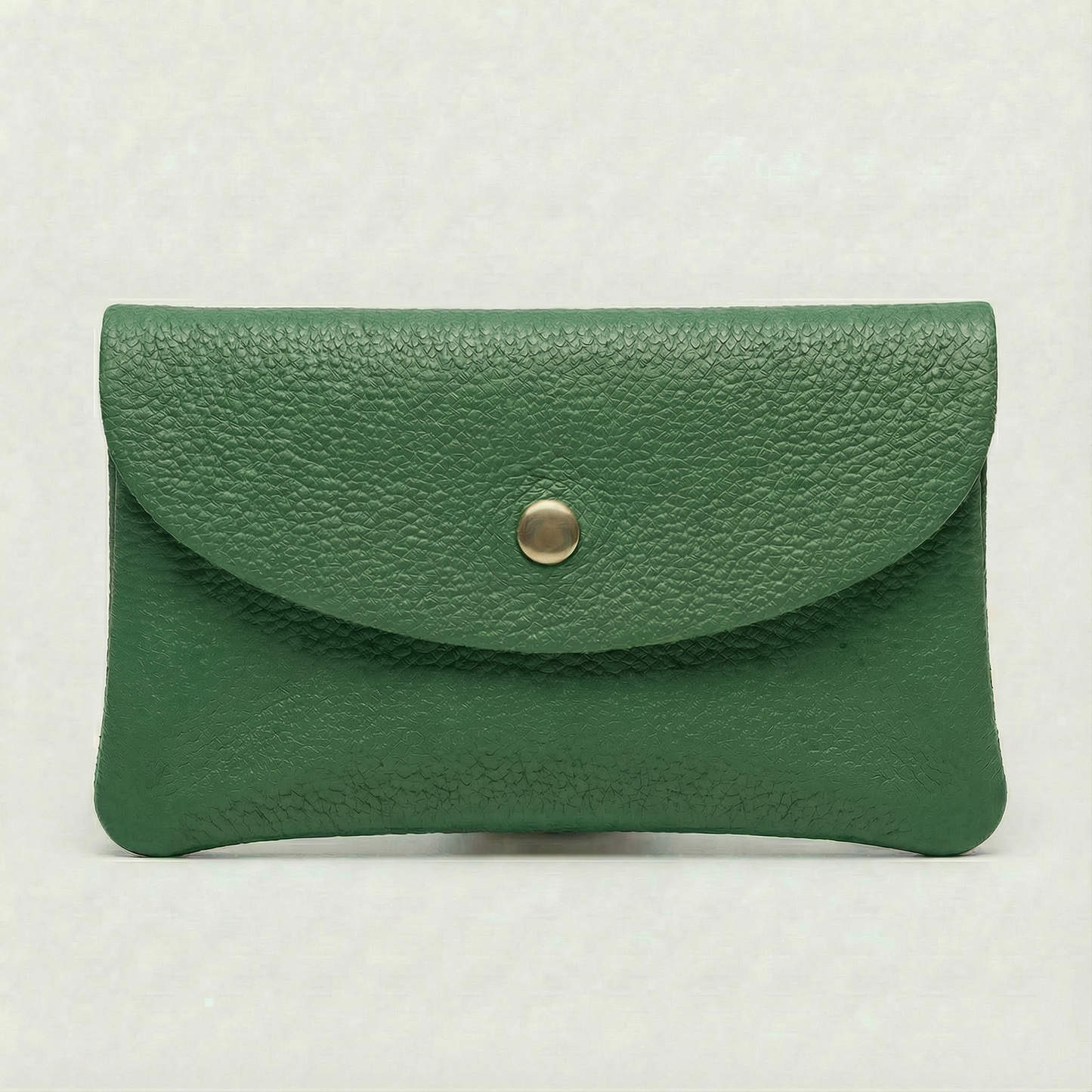 Kelly green pebble leather mini coin wallet with snap closure, compact Italian‑made design for coins and small essentials