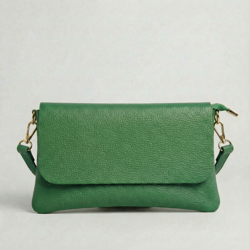 Kelly Green pebble leather crossbody bag with a matching color adjustable strap, displayed on a light gray background.