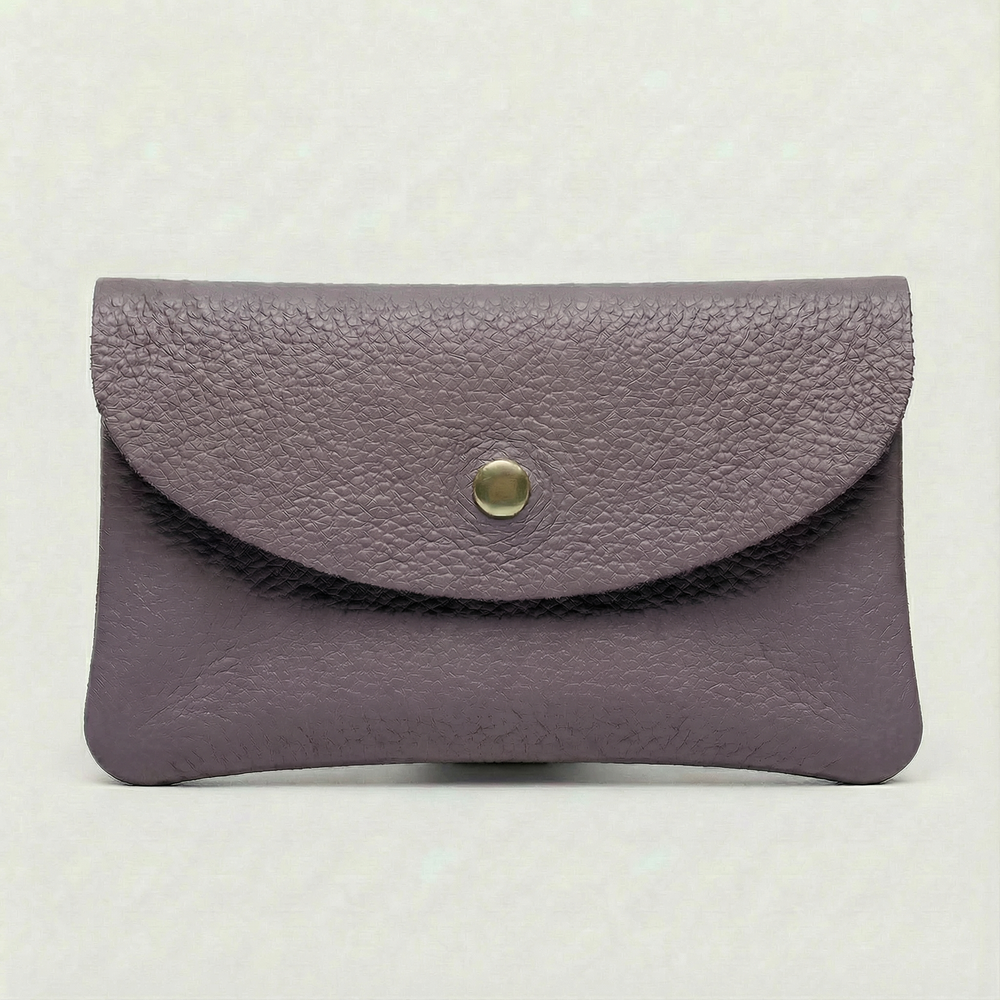 Lavender pebble leather wallet collection featuring Mini Coin Wallet, Coin Wallet, and Cellphone Wallet in genuine leather, made in Italy.
