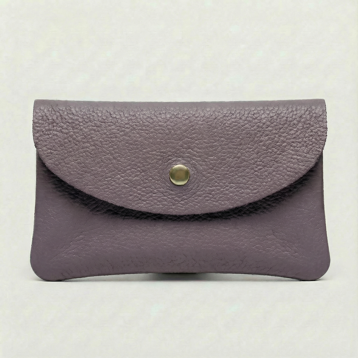Lavender pebble leather wallet collection featuring Mini Coin Wallet, Coin Wallet, and Cellphone Wallet in genuine leather, made in Italy.
