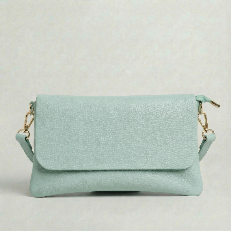 Light Blue pebble leather crossbody bag with a matching color adjustable strap, displayed on a light gray background.