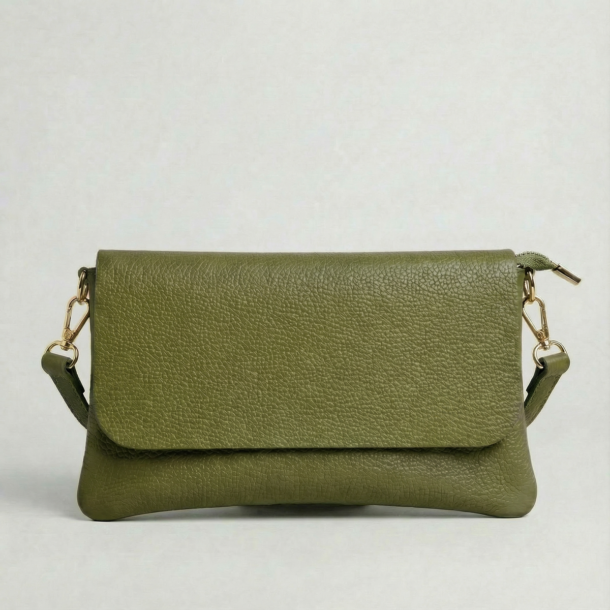 Olive pebble leather crossbody bag with a matching color adjustable strap, displayed on a light gray background.
