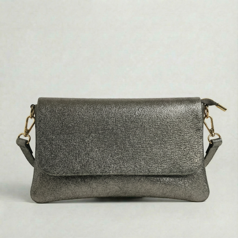Pewter metallic leather crossbody bag with a matching color leather strap, displayed on a light gray background.