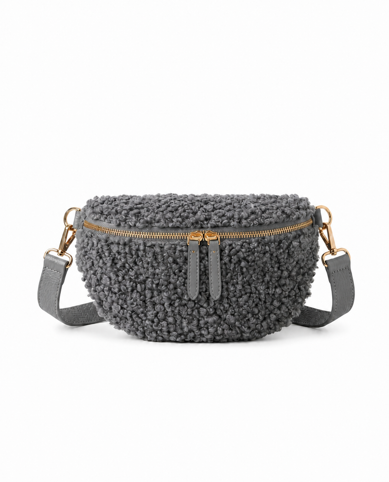 Stylish steel gray teddy fabric and leather fanny bag with an adjustable strap.