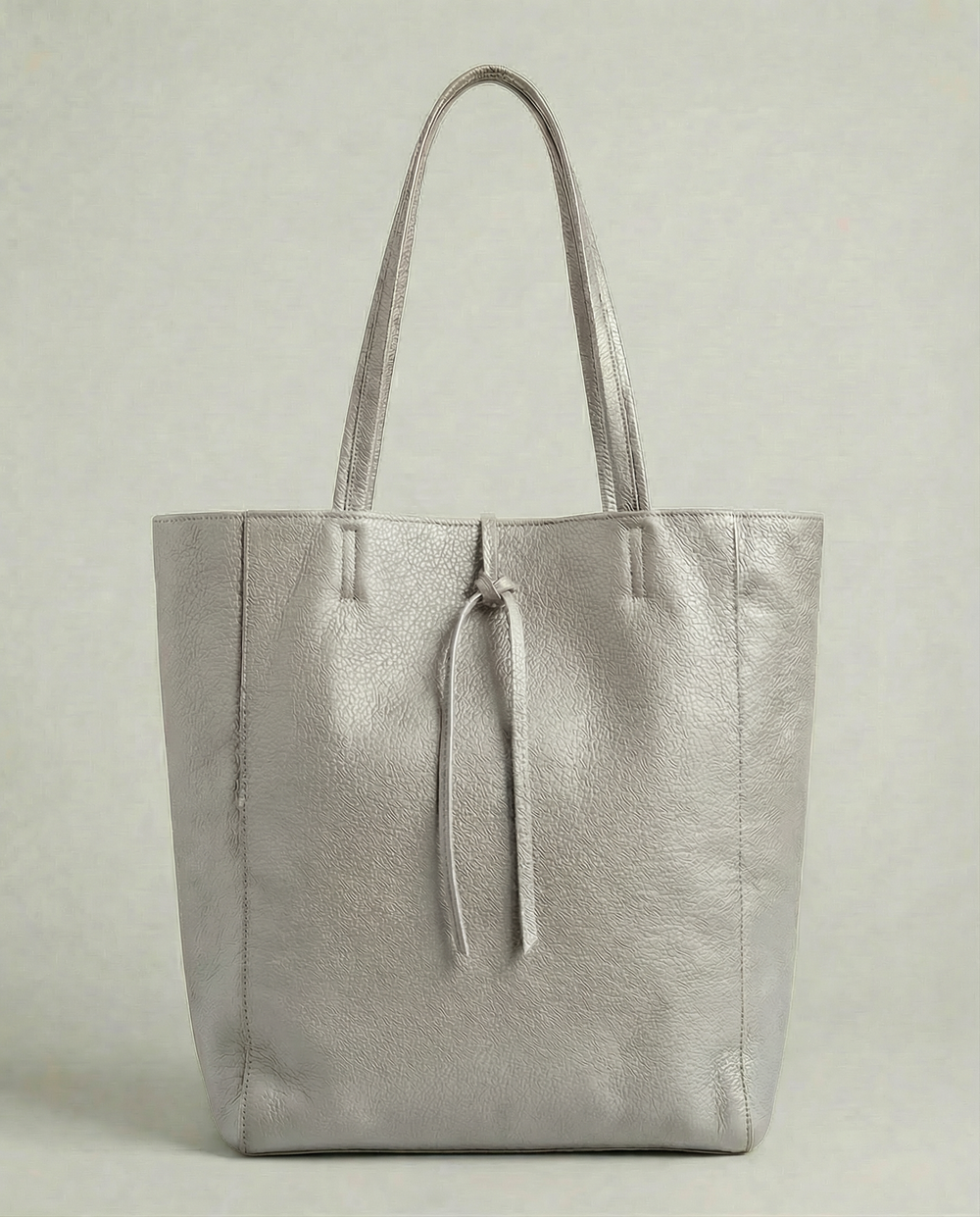Platinum pebble leather tote bag available in Tote Bag and Mini Tote sizes.