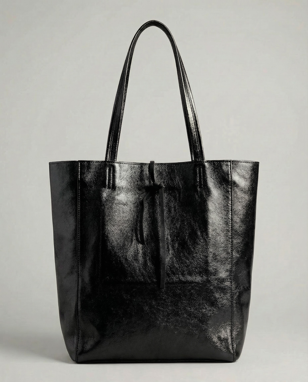 Black metallic leather tote bag available in Tote Bag and Mini Tote sizes.