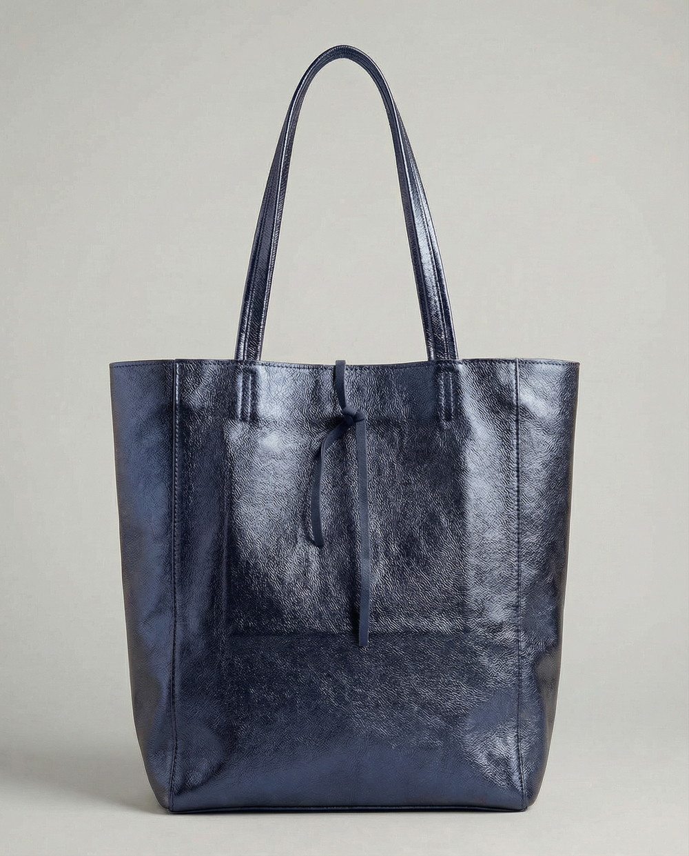 Indigo metallic leather tote bag available in Tote Bag and Mini Tote sizes.