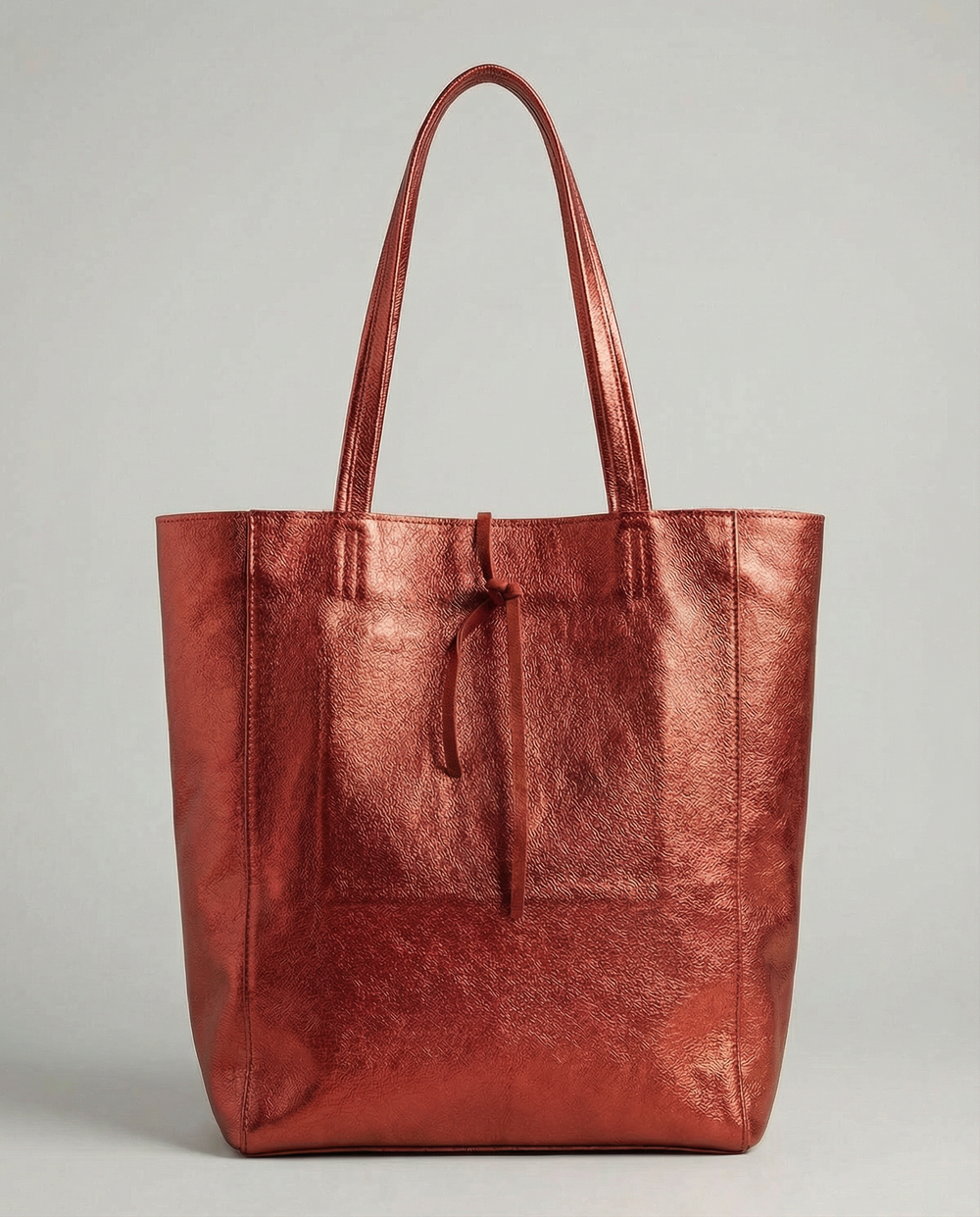 Red metallic leather tote bag available in Tote Bag and Mini Tote sizes.