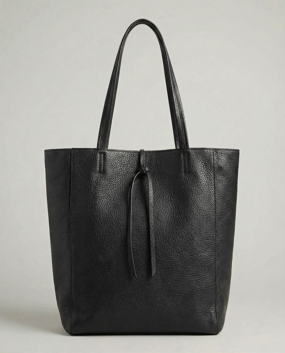 Black pebble leather tote bag available in Tote Bag and Mini Tote sizes.