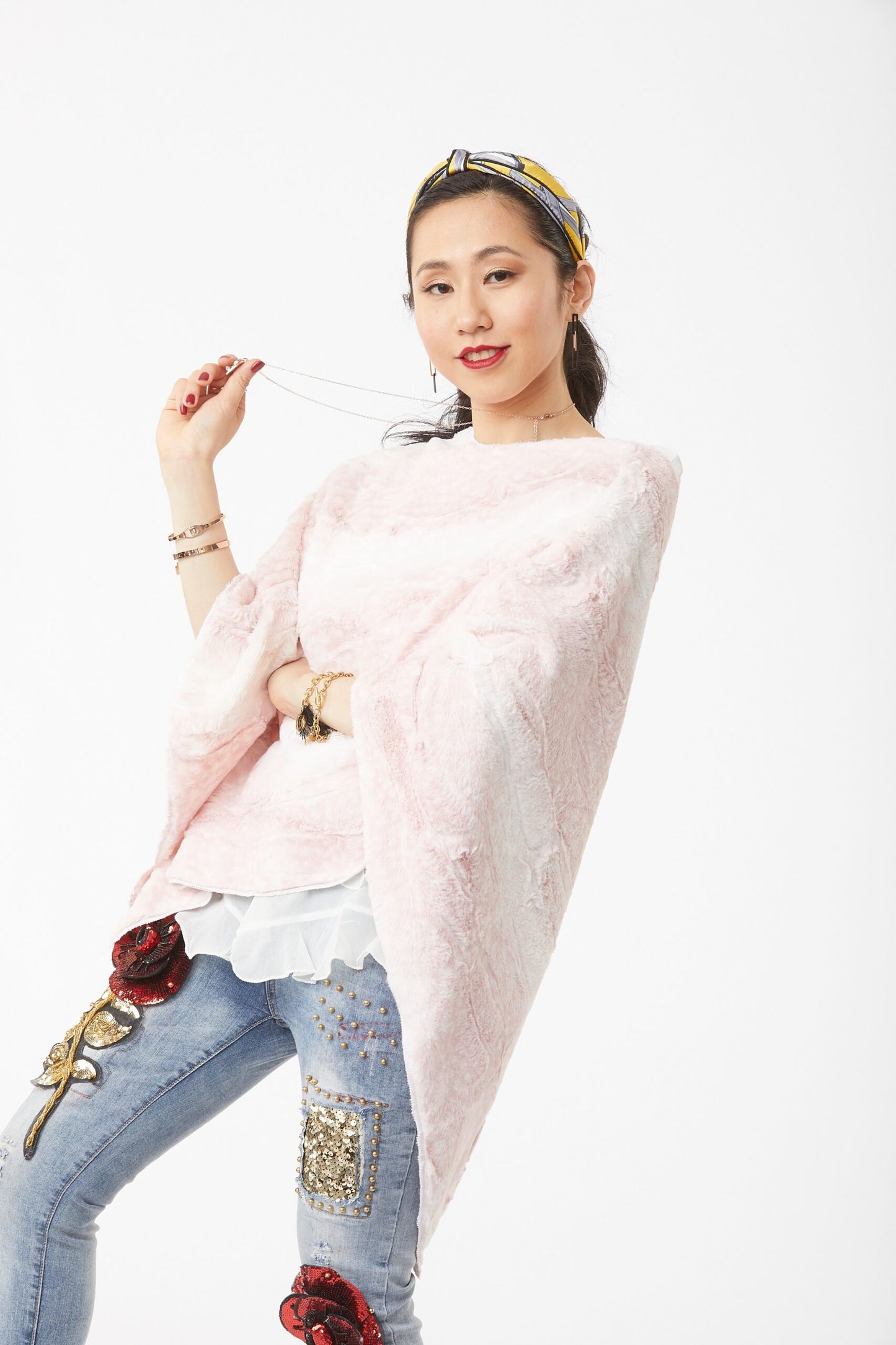 Woman posing wearing Blush and Cream Siberian Leopard Poncho
