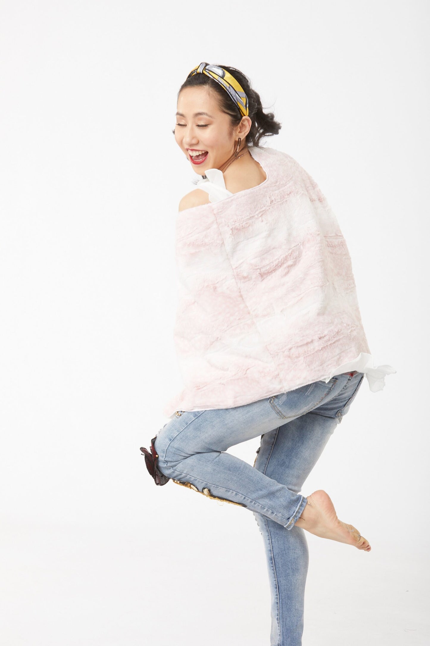 Alternative pose of woman wearing Blush and Cream Siberian Leopard Poncho