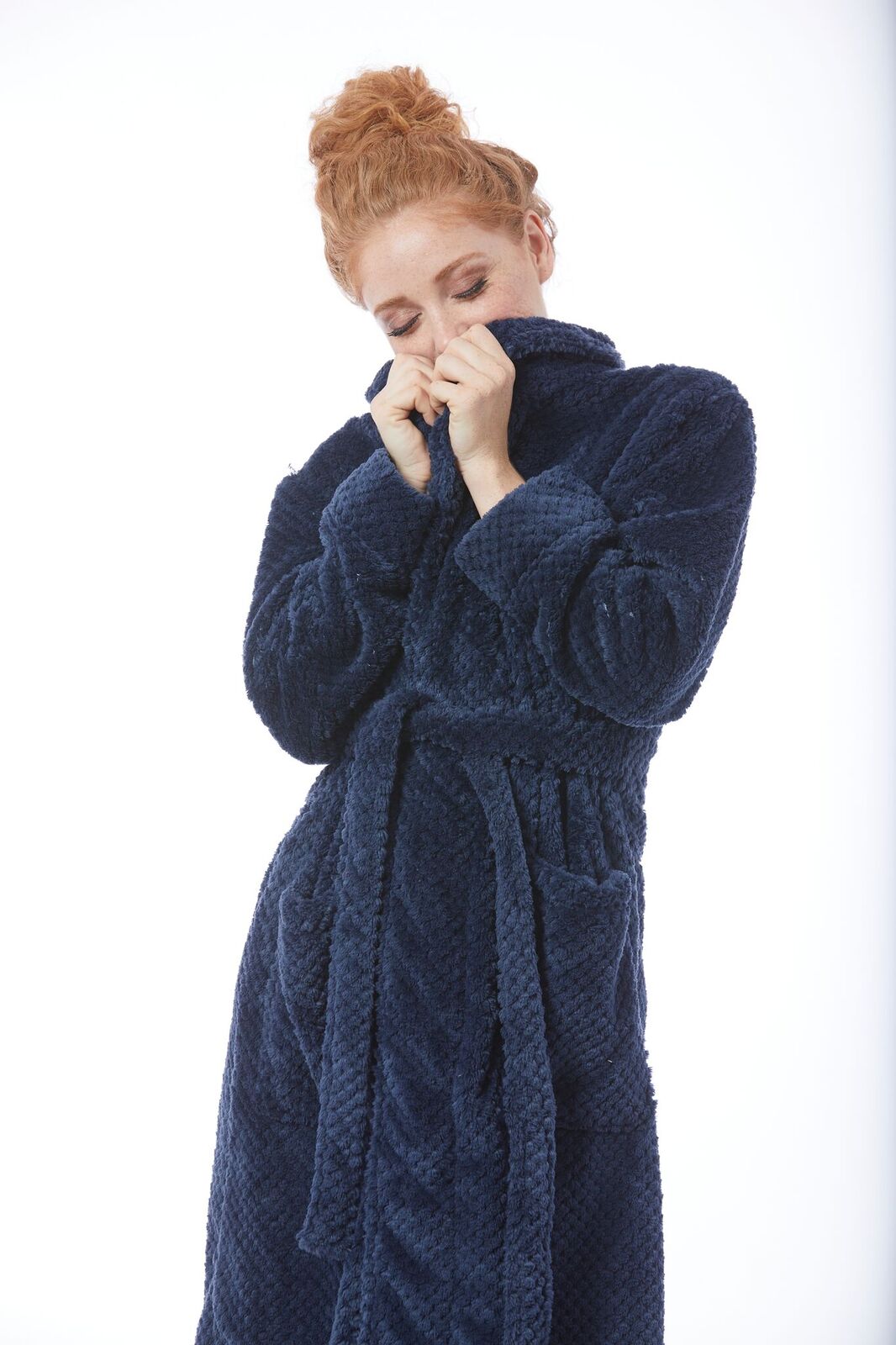 Woman wearing a Navy Kristine Robe with collars closed