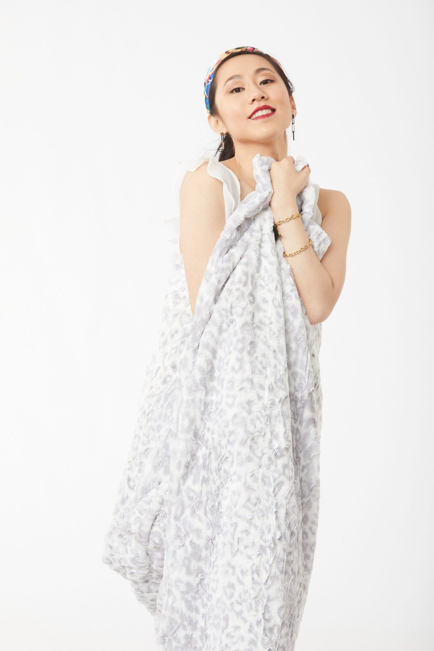 Woman wrapped wearing Wild Jacquard Luscious Throw – Silver