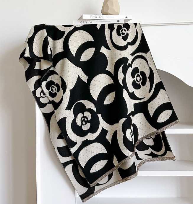 Black and white wrap draped over a chair