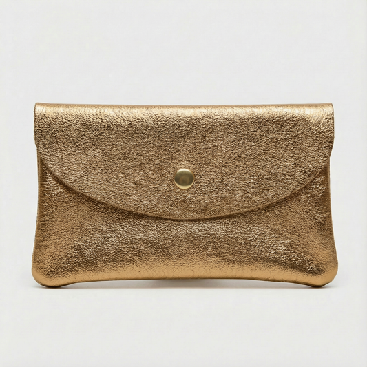 Antigue gold metallic leather cellphone wallet on a light gray background