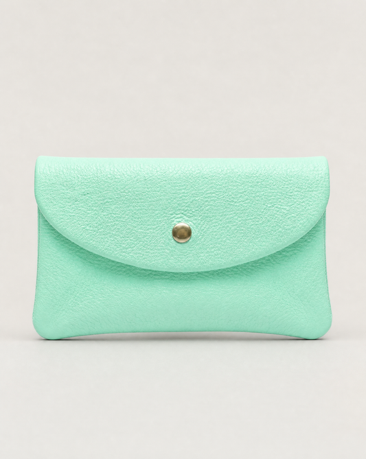 Aqua pebble leather coin wallet with snap closure, minimalist Italian design, compact and elegant everyday accessory.