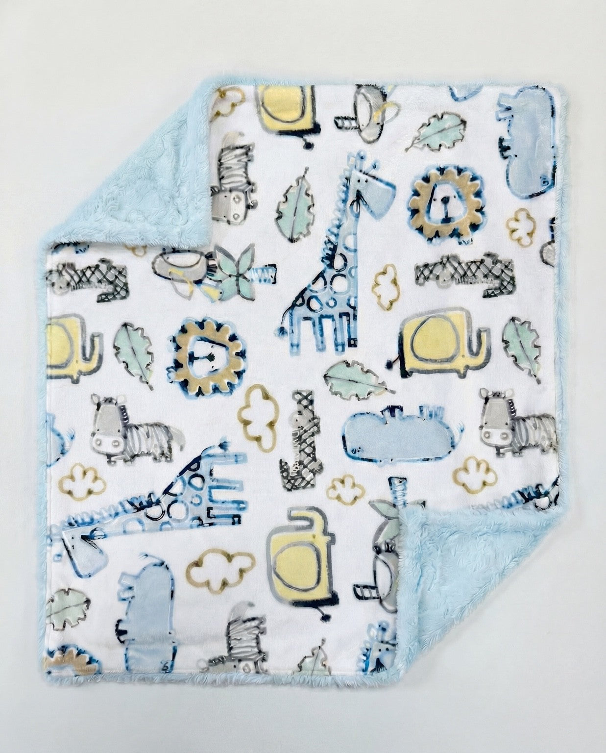 Baby blanket with animal pattern on a light gray background