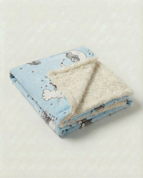 Lullaby blue baby blanket with sleeping baby elephant on the moon with clouds and stars and plush ivory rosebud backing.