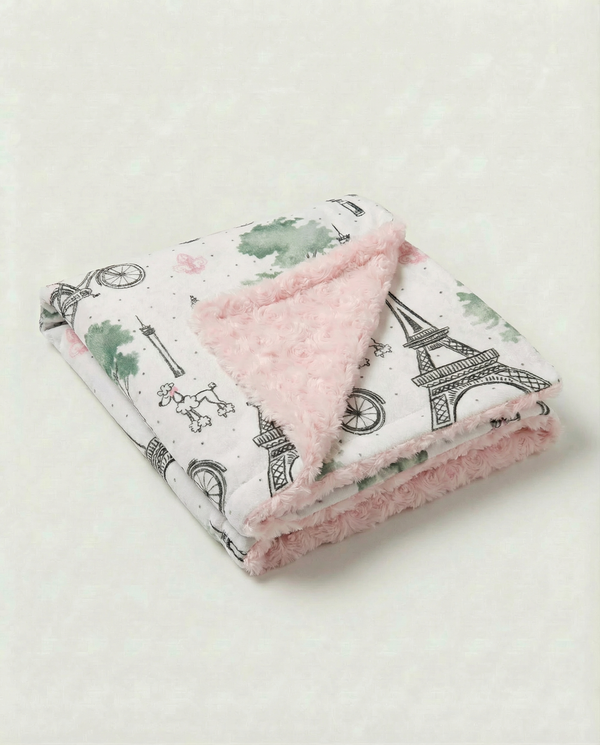 Baby blanket with Eiffel Tower Paris print and plush pink rosebud embossed backing for cozy newborn snuggles.
