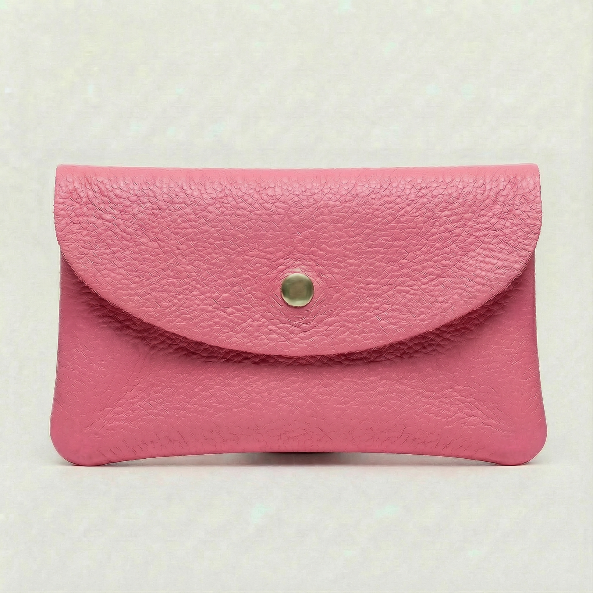 Barbie Pink pebble leather wallet collection featuring Mini Coin Wallet, Coin Wallet, and Cellphone Wallet in genuine leather, made in Italy.