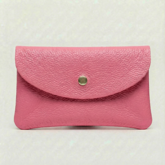Barbie Pink pebble leather wallet collection featuring Mini Coin Wallet, Coin Wallet, and Cellphone Wallet in genuine leather, made in Italy.