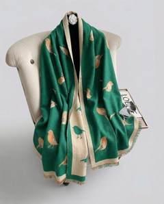 Green wrap with bird pattern draped over a mannequin on a white background, view 2