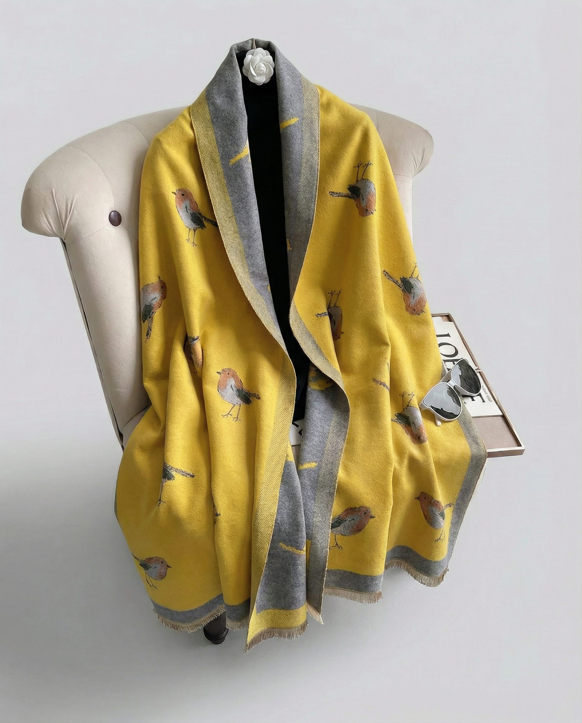 Yellow wrap with bird pattern on a chair