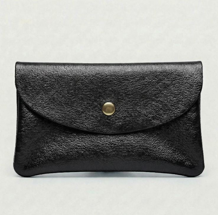 Metallic Black wallet with a gold button on a light gray background