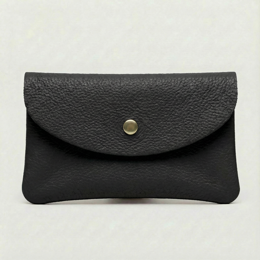 Black pebble leather coin wallet with snap closure, minimalist Italian design, compact and elegant everyday accessory.