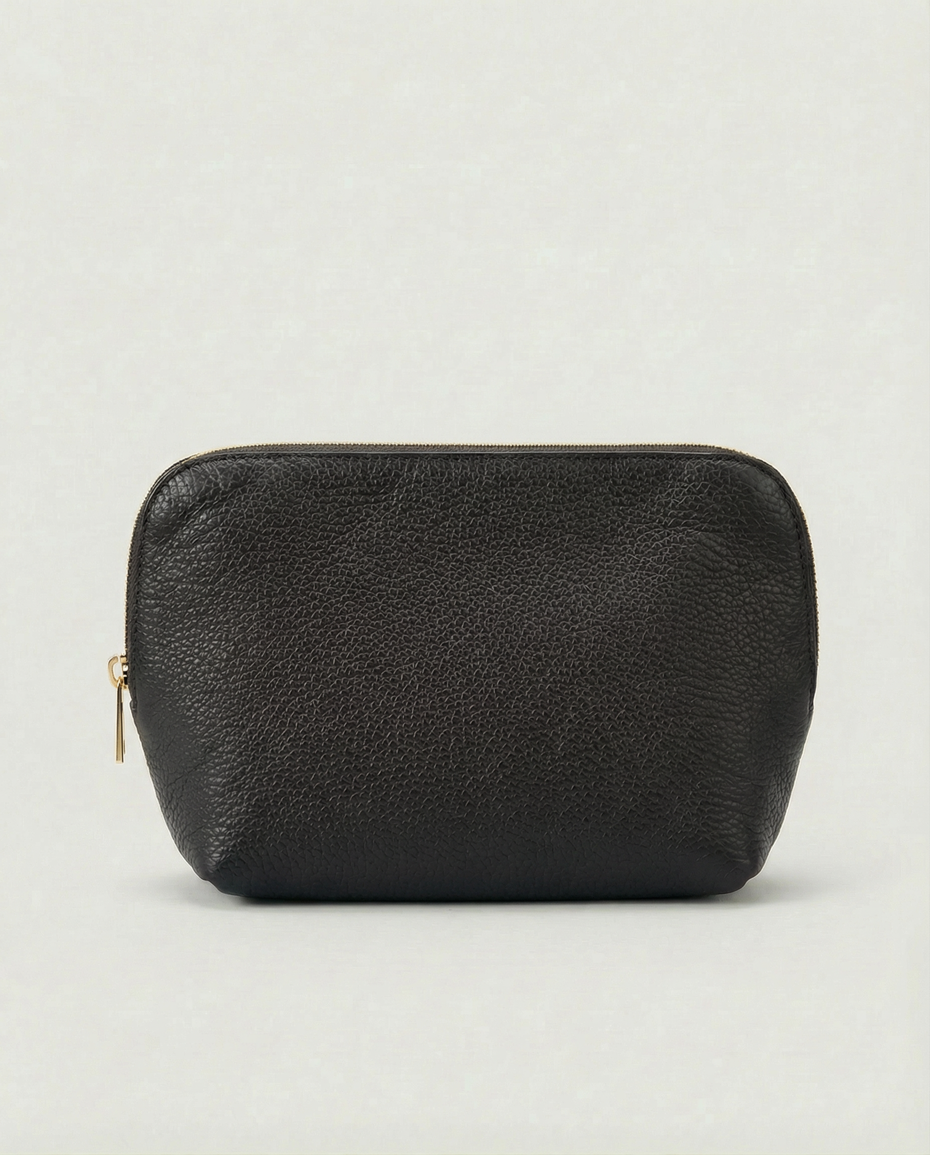 Pebble leather cosmetic bag with zip closure, available in black, structured silhouette for everyday essentials.