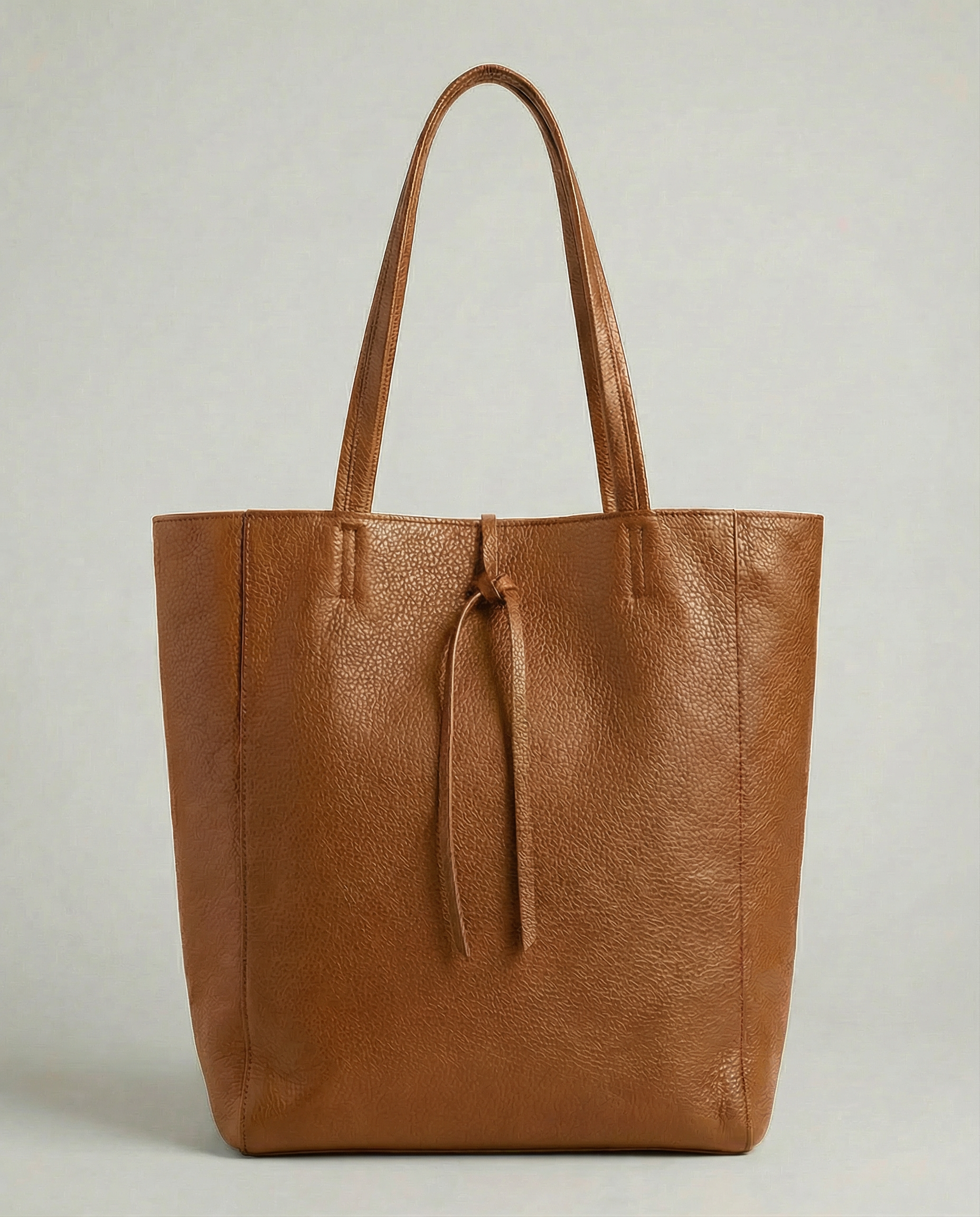 Caramel pebble leather tote bag available in Tote Bag and Mini Tote sizes. 

