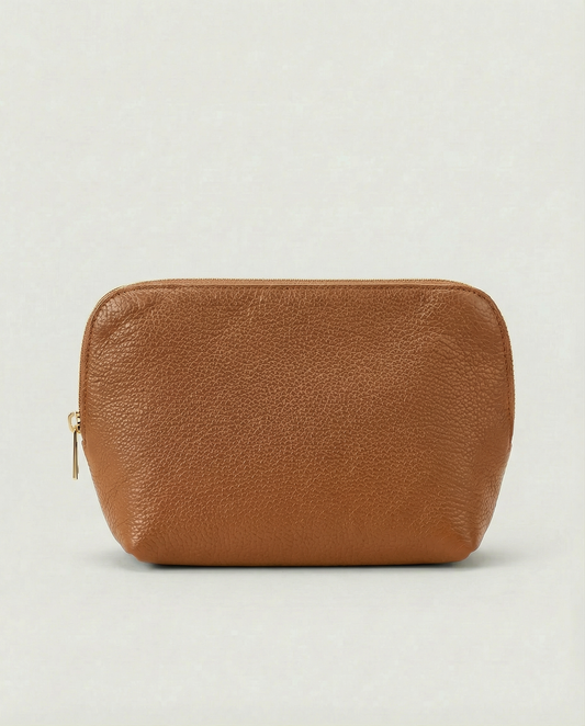 Pebble leather cosmetic bag with zip closure, available in caramel, structured silhouette for everyday essentials.