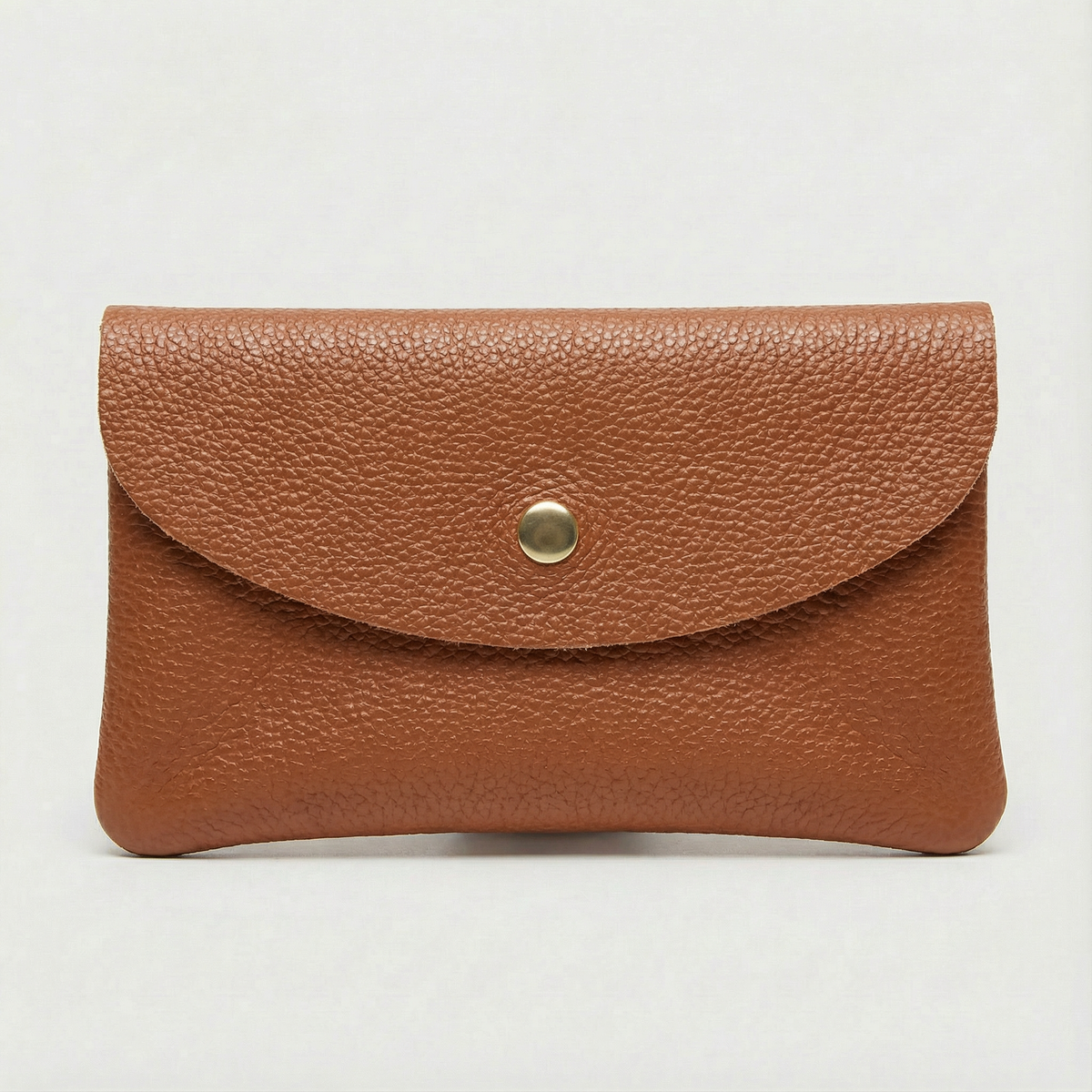 Caramel pebble leather wallet collection featuring Mini Coin Wallet, Coin Wallet, and Cellphone Wallet in genuine leather, made in Italy.
