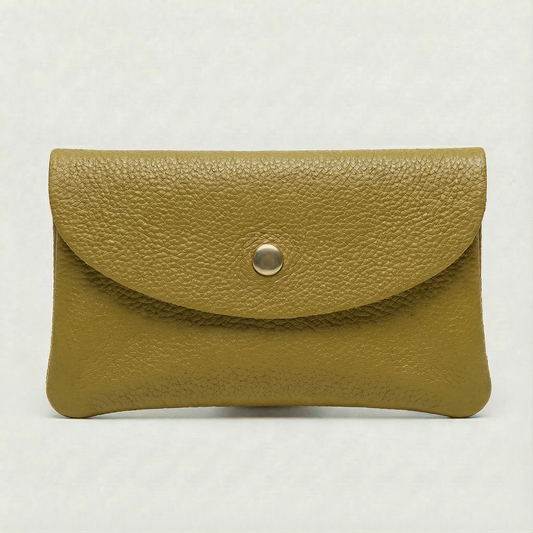 Chartreuse color leather cellphone wallet with a gold button on a light gray background