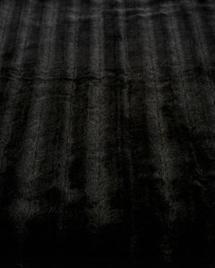Channels Throw in Black, sculpted faux-fur blanket, view 1