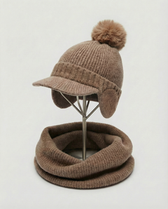 Brown knit hat with pom-pom and matching neckwarmer on a mannequin stand against a white background, view 1