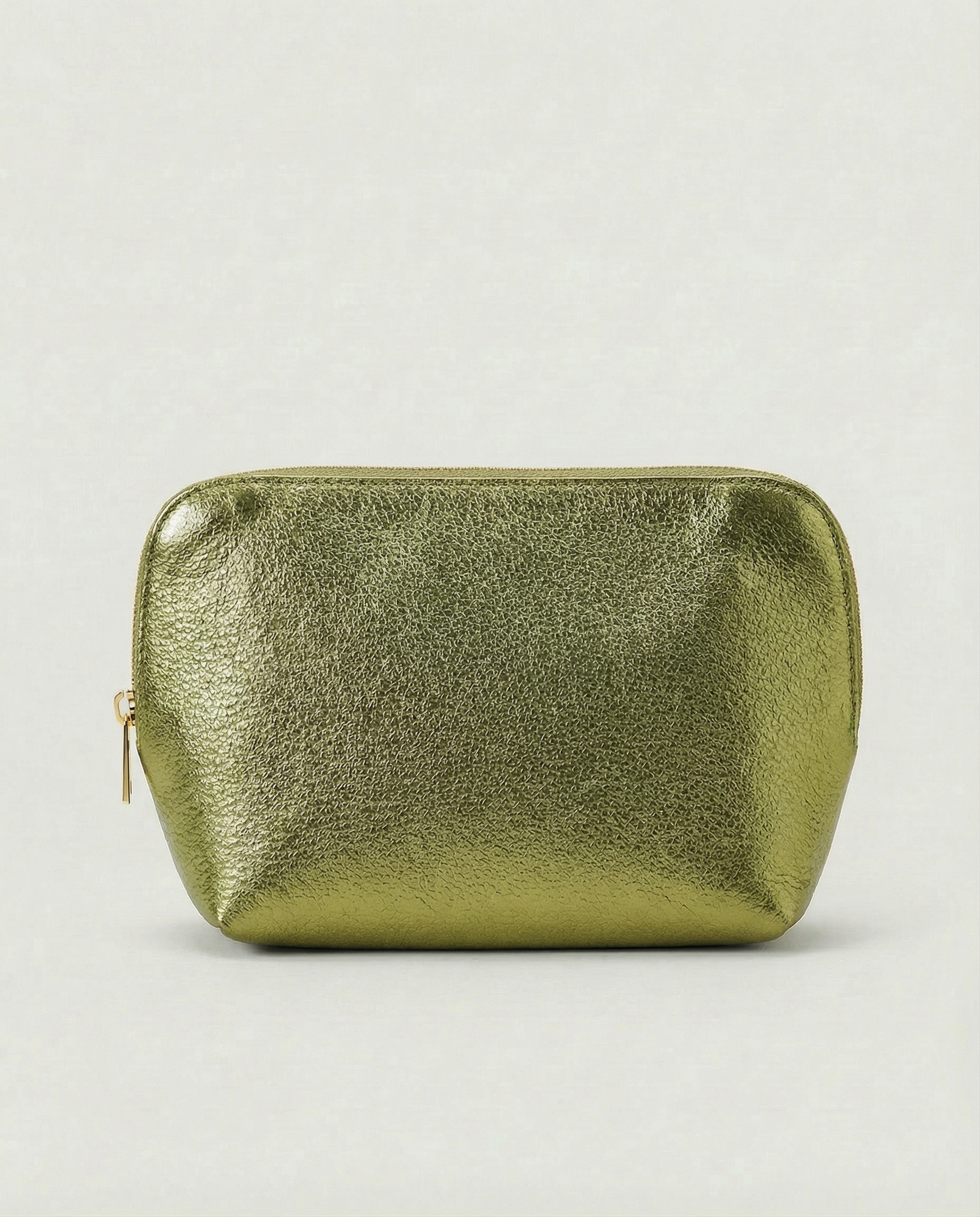 Metallic pistachio leather cosmetic bag with structured shape and top zip closure, shown in a sleek, minimalist style.