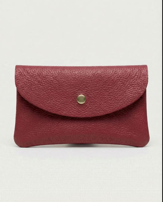 Cranberry color leather cellphone wallet with a gold button on a white background