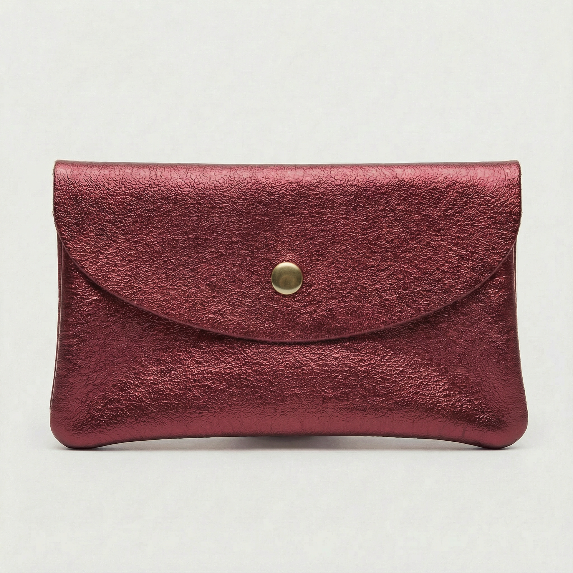 Mini coin wallet in cranberry metallic leather with snap closure, compact Italian‑made design for coins and small essentials
