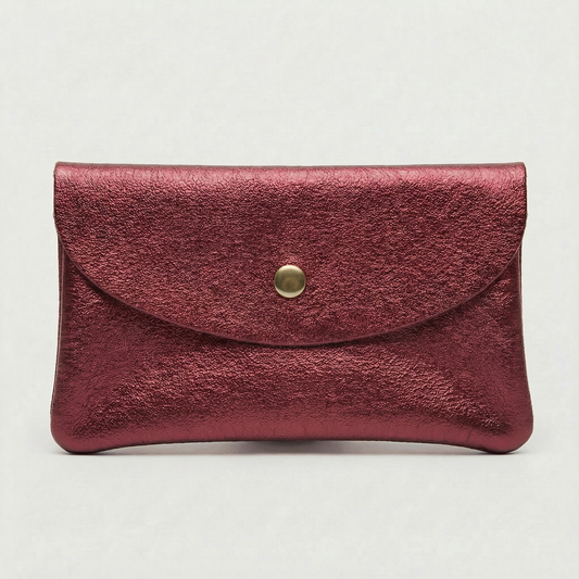 Mini coin wallet in cranberry metallic leather with snap closure, compact Italian‑made design for coins and small essentials